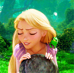 rapunzel from tangled is holding a rock with a frog on her shoulder