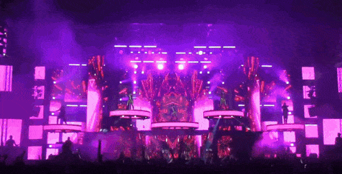 a stage with purple lights and a sign that says ' i love you ' on it