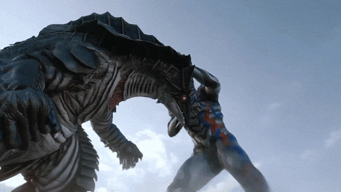 a monster with a red eye is being attacked by a man