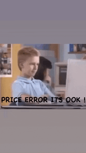 a boy sitting in front of a laptop with the words price error it 's ok on the bottom