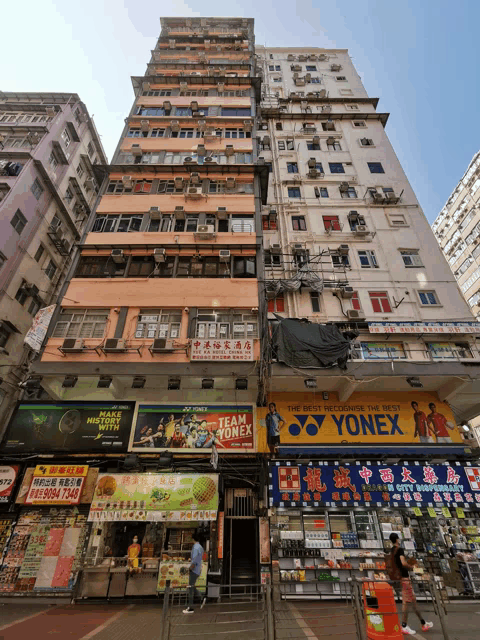 a yonex store sits on the side of a tall building