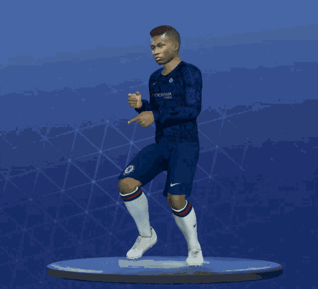 a soccer player in a blue shirt and shorts is pointing at something