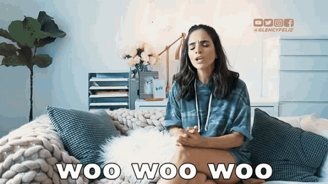 a woman is sitting on a bed with the words woo woo woo written on the bottom