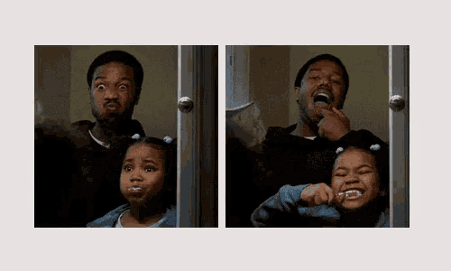 a man and a little girl brushing their teeth in front of a mirror