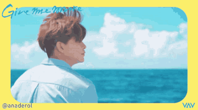 a picture of a man looking at the ocean with the words give me more written on the bottom