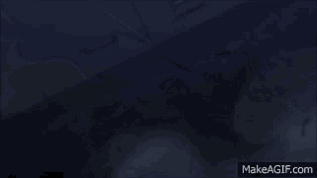 a tank is shown in a dark scene with the words makeagif.com below it