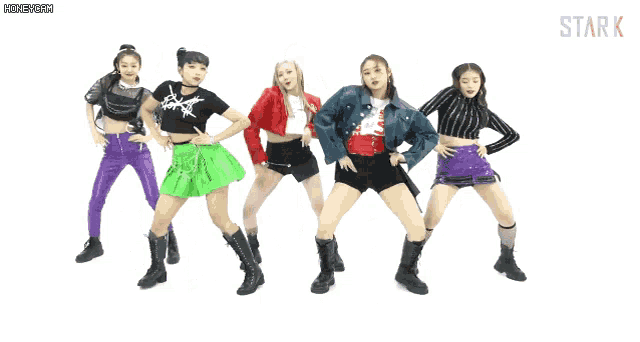 a group of girls are dancing in front of a white background that says stark on it