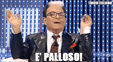 a man in a suit and tie is saying " e palloso "