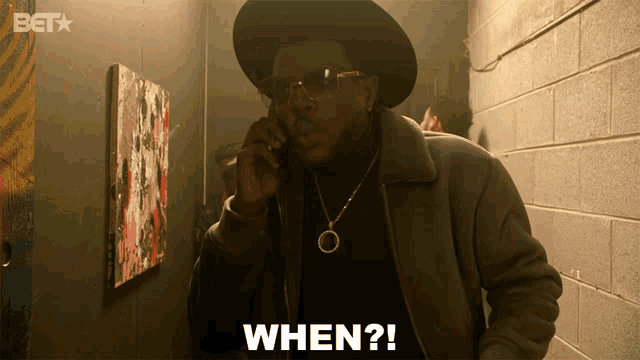 a man is talking on a cell phone and the word when is on the screen