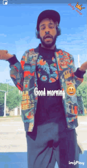 a man wearing headphones says good morning