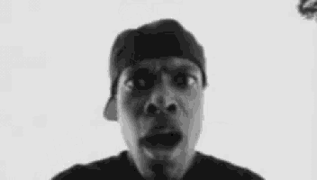 a black and white photo of a man with his mouth open and the words `` you got knocked '' behind him .
