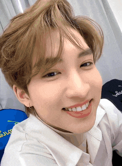 a close up of a person 's face with a smile on it