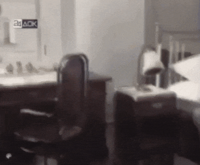 a blurry picture of a bedroom with a sign that says 24 aok on it
