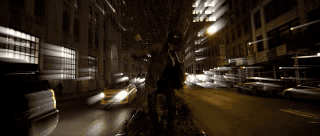 a blurred image of a city street with a sign that says no parking