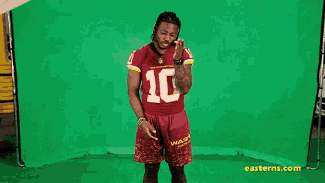 a man wearing a jersey with the number 10 on it