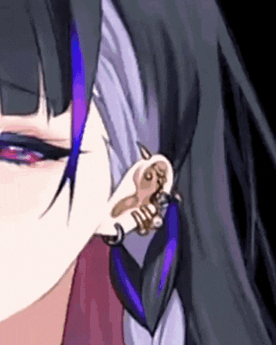 a close up of a girl 's ear with purple hair and piercings