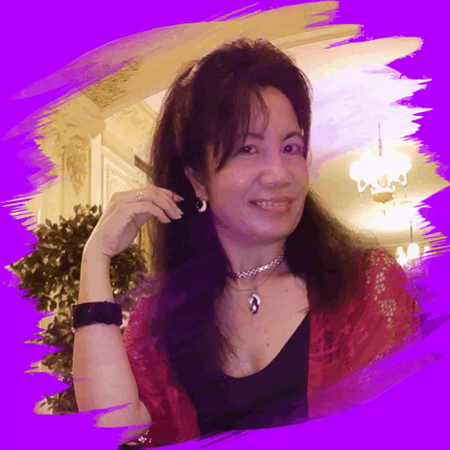 a woman wearing a choker and earrings smiles in front of a purple border