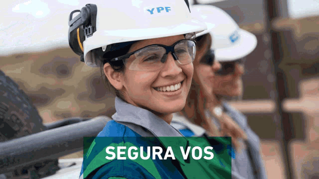a woman wearing a hard hat that says ypf