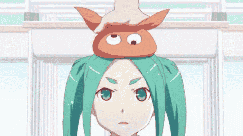 a person is putting a donut on the head of a girl with green hair .