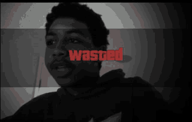 a black and white photo of a man with the word wasted written in red