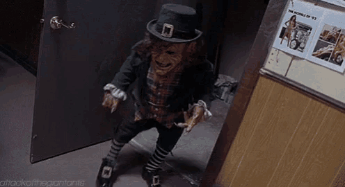 a leprechaun in a black hat is standing in a doorway in a room .