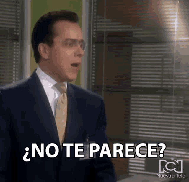 a man in a suit and tie is saying " no te parece "