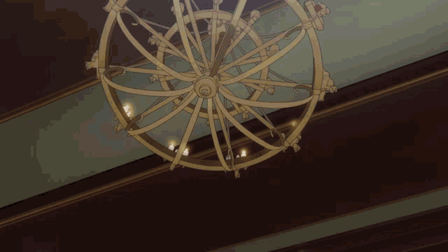 a chandelier is hanging from the ceiling and has candles hanging from it