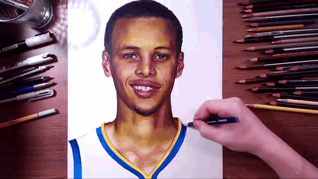 a person is drawing a picture of a basketball player with a pen that says ' prismacolor ' on it