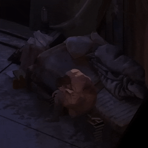 a dark room with a statue of a man sitting on a bench