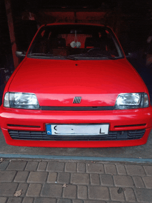 a red car with a license plate that says c and l