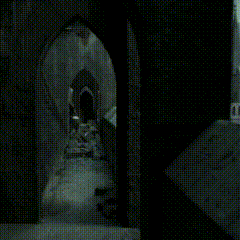 a blurry picture of a person walking down a dark hallway