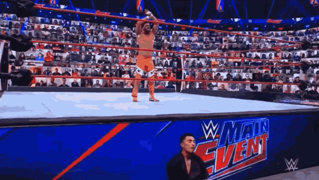 a wrestling ring with a sign that says main event on it