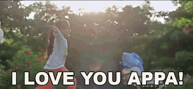 a little girl is holding a stuffed animal and saying `` i love you appa ''