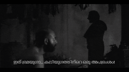 a man with a beard is standing next to a woman in a room .