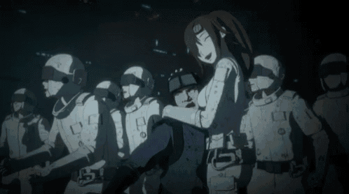 a woman is standing in front of a group of soldiers in a dark room .
