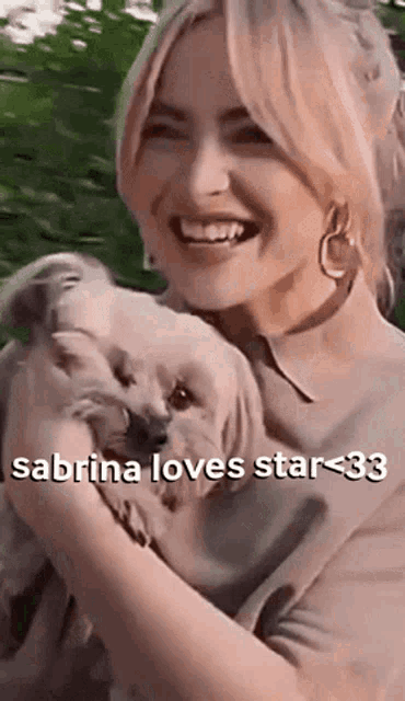 a woman holding a small dog with the words sabrina loves star 33