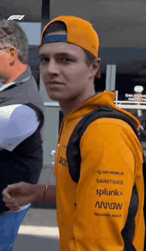 a man wearing a hat and a hoodie with the word splunk on the back