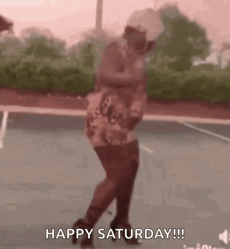 a woman is dancing on a tennis court with the words `` happy saturday '' written on the bottom .