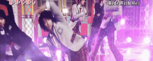 a group of men are dancing on a stage and the words ride with me are on the bottom of the screen