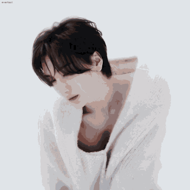 a man in a white sweater with everlast written on the bottom right