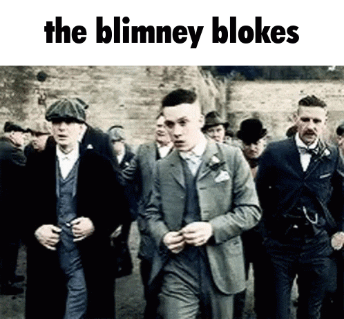 a group of men in suits and hats are walking down a street with the words the blimney blokes above them .