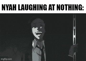 a man in a suit is laughing at nothing .