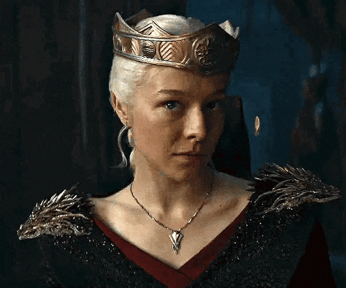 the woman is wearing a crown and a necklace .