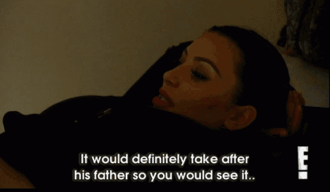 kim kardashian laying on a bed with a caption that says it would definitely take after his father