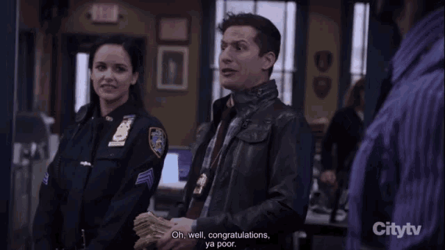 a police officer is holding a stack of money and says " congratulations "