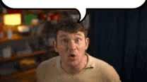 a man with a surprised look on his face is standing in front of a speech bubble .