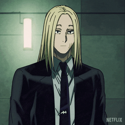 a man with long blonde hair is wearing a suit and tie with netflix written on the bottom