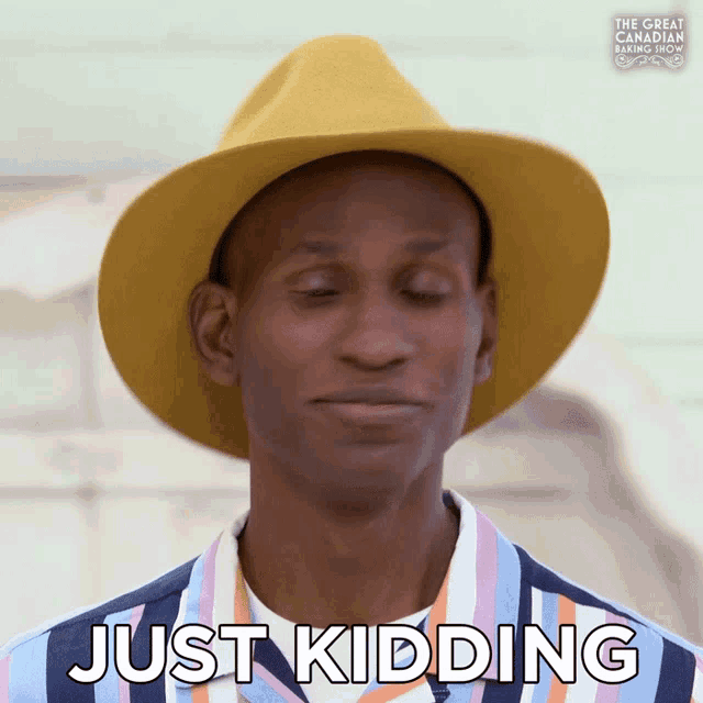 a man wearing a hat says just kidding on the screen