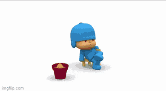 a cartoon character named pocoyo is sitting on a chair next to a red bucket
