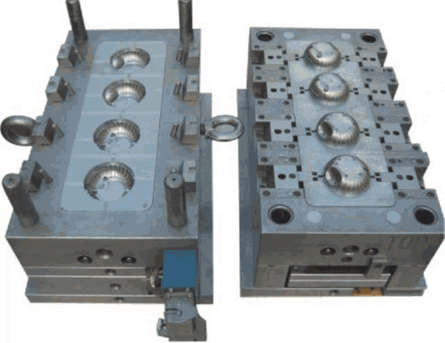 a metal mould with the word top on the side